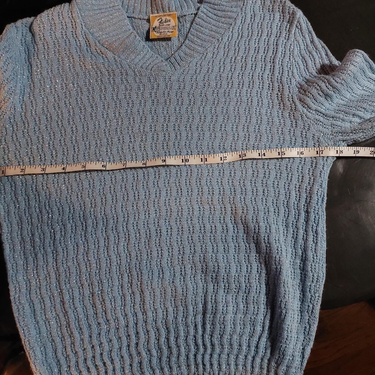Vintage baby blue and silver metallic sweater.