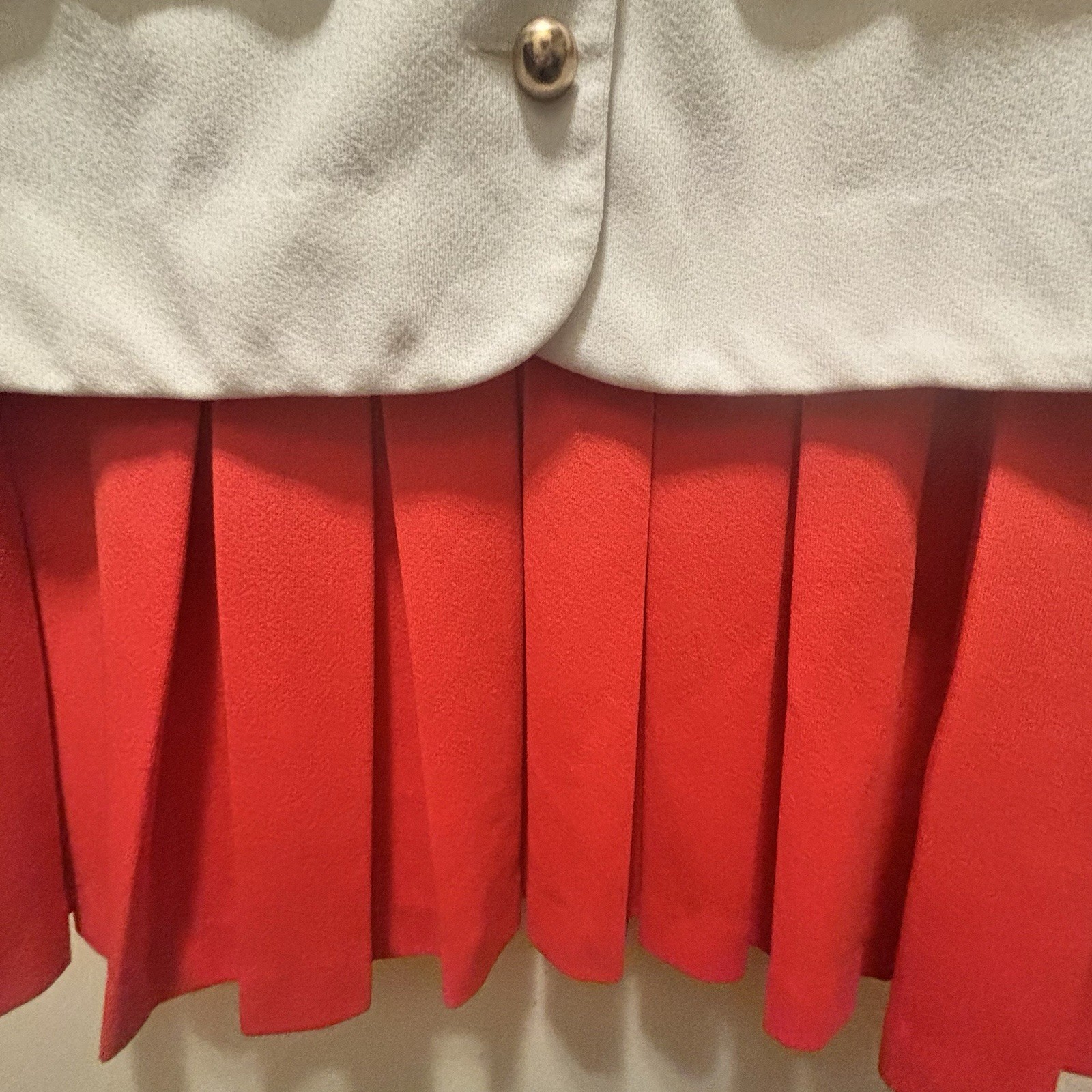 1960’s Mod style Eve Le Coq Mod white vest Attached Orange Pleated Skirt