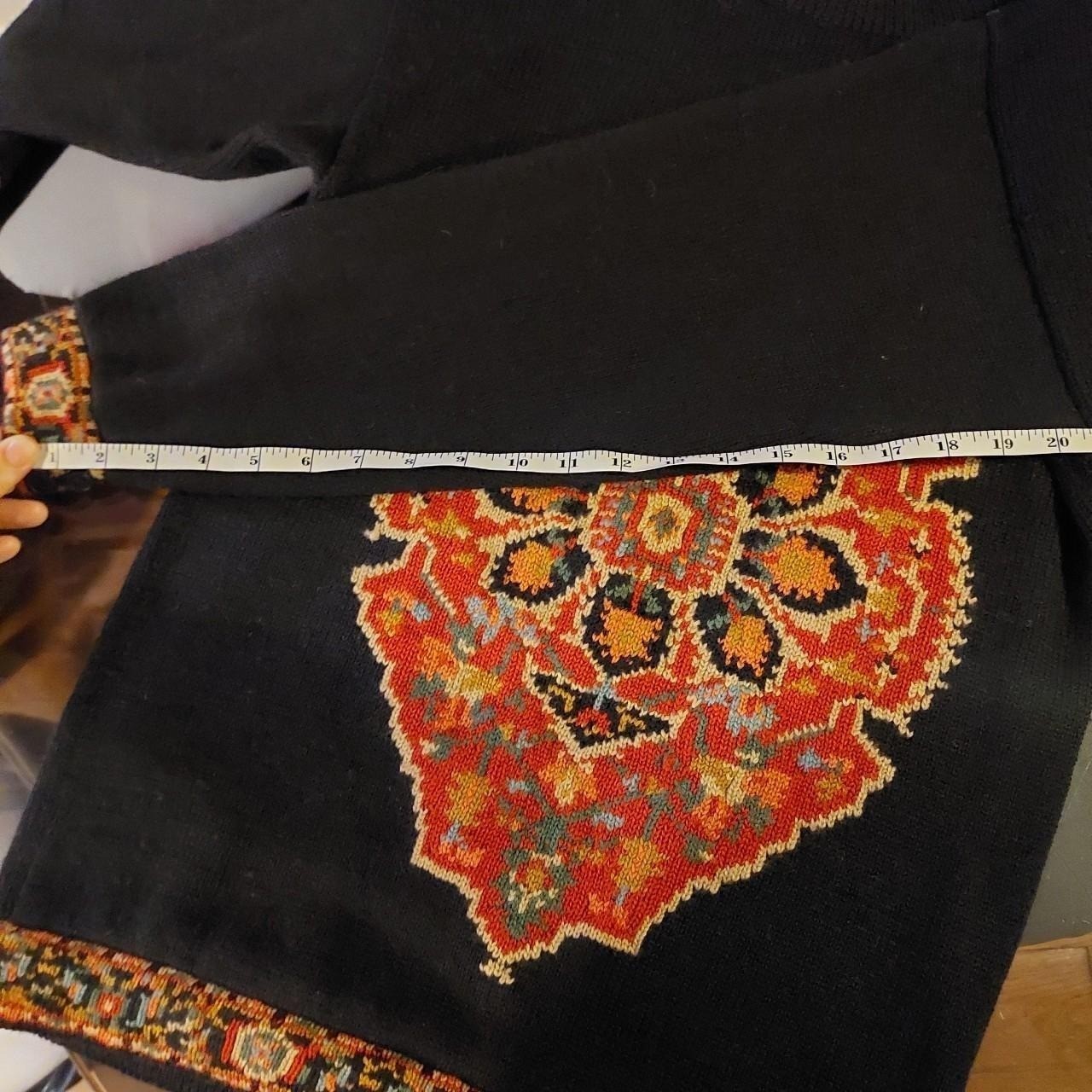 Vintage 100% wool black sweater with button detail.