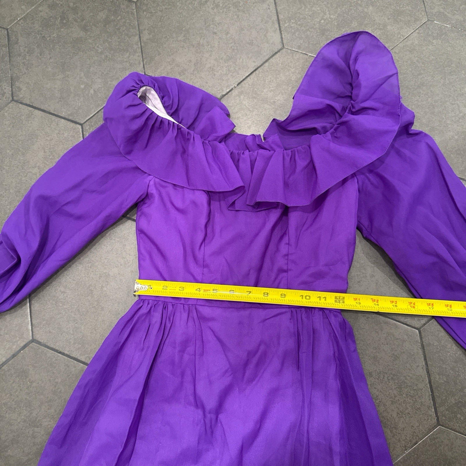 An vintage Priscilla Of Boston Chic long sleeve dress with ruffles.
