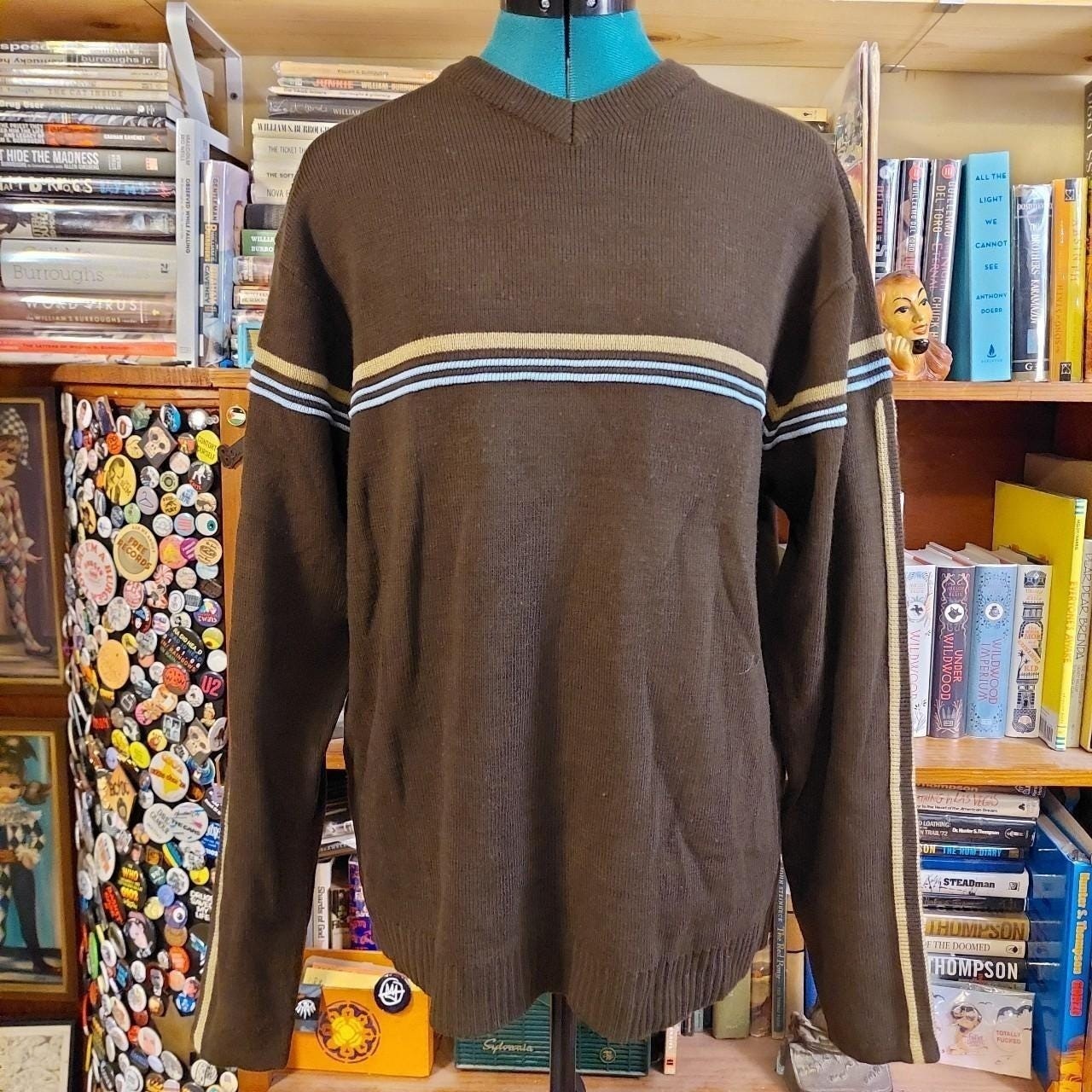 Vintage brown, blue, and tan sweater with striped detail.