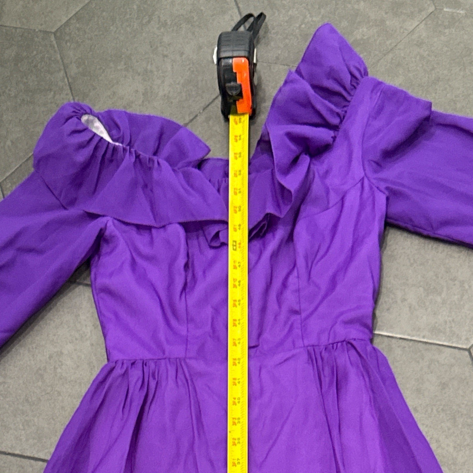 An vintage Priscilla Of Boston Chic long sleeve dress with ruffles.