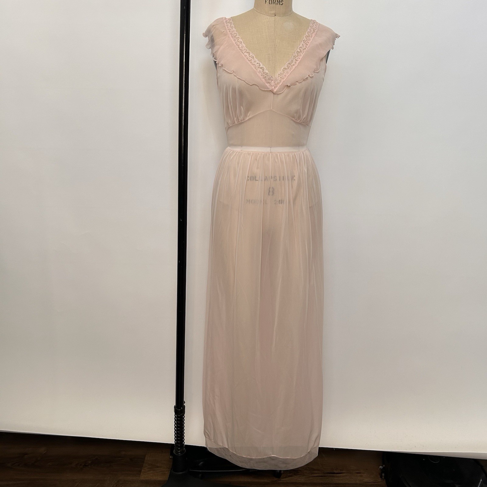 Pink sheer vintage maxi dress with damaged lace trim and ruffle details.