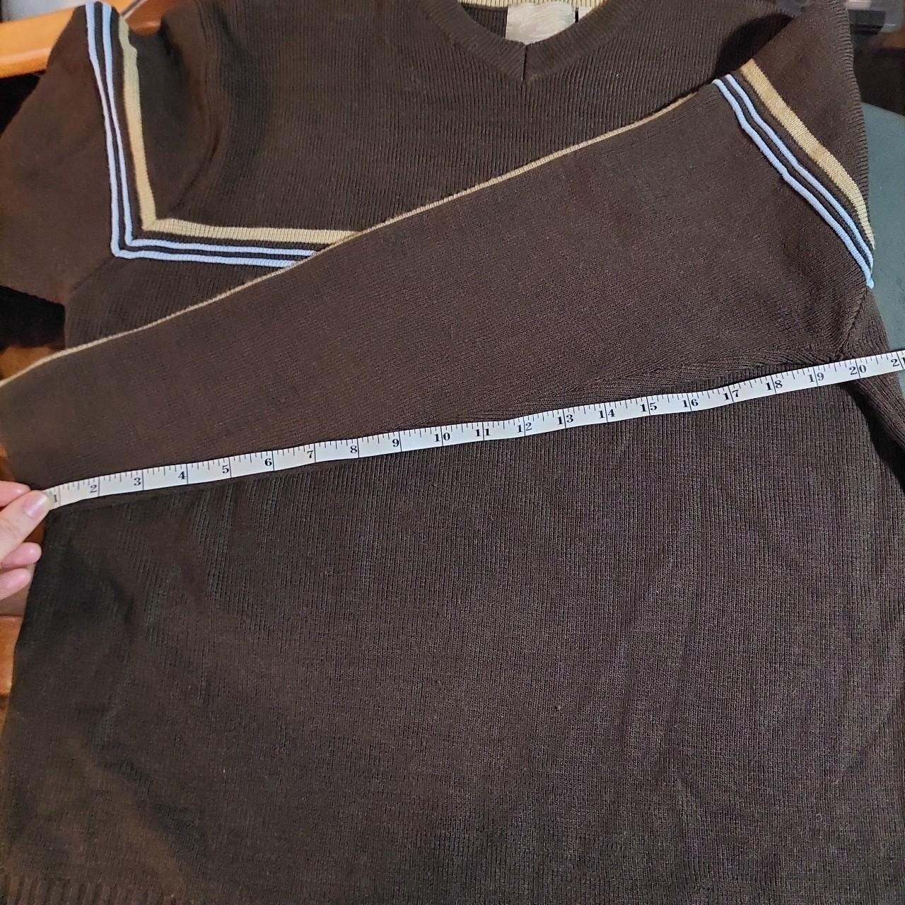Vintage brown, blue, and tan sweater with striped detail.