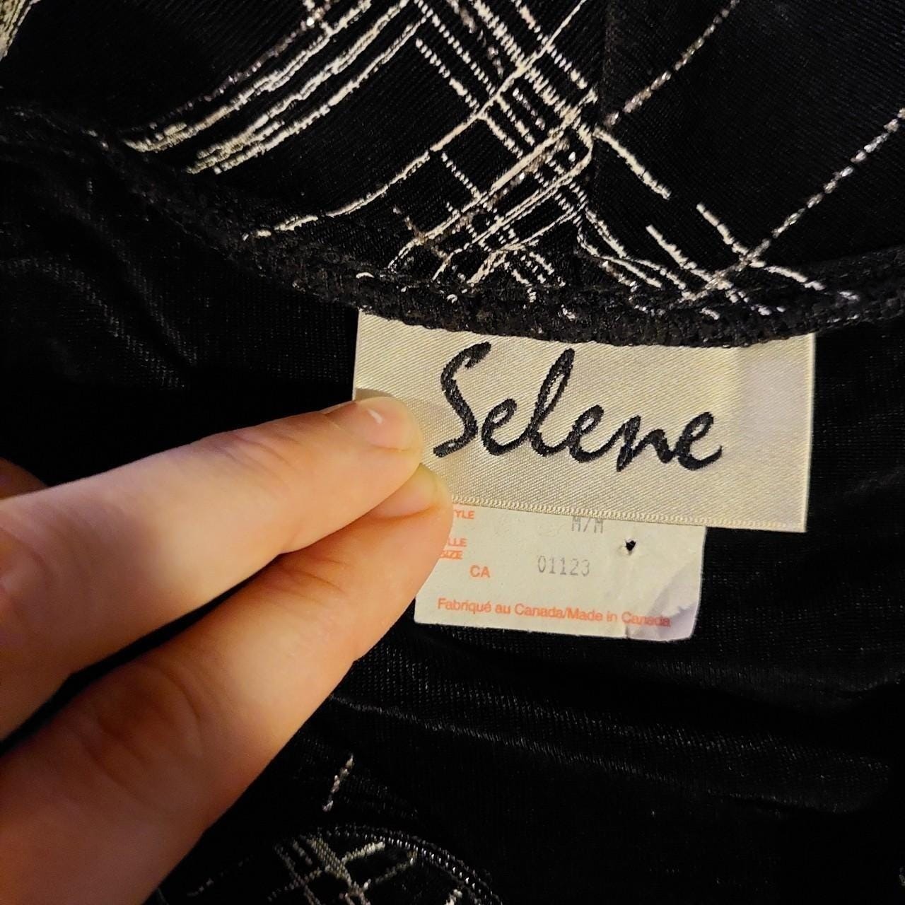 Vintage made in Canada black and silver zip up. It is slightly sheer and stretch