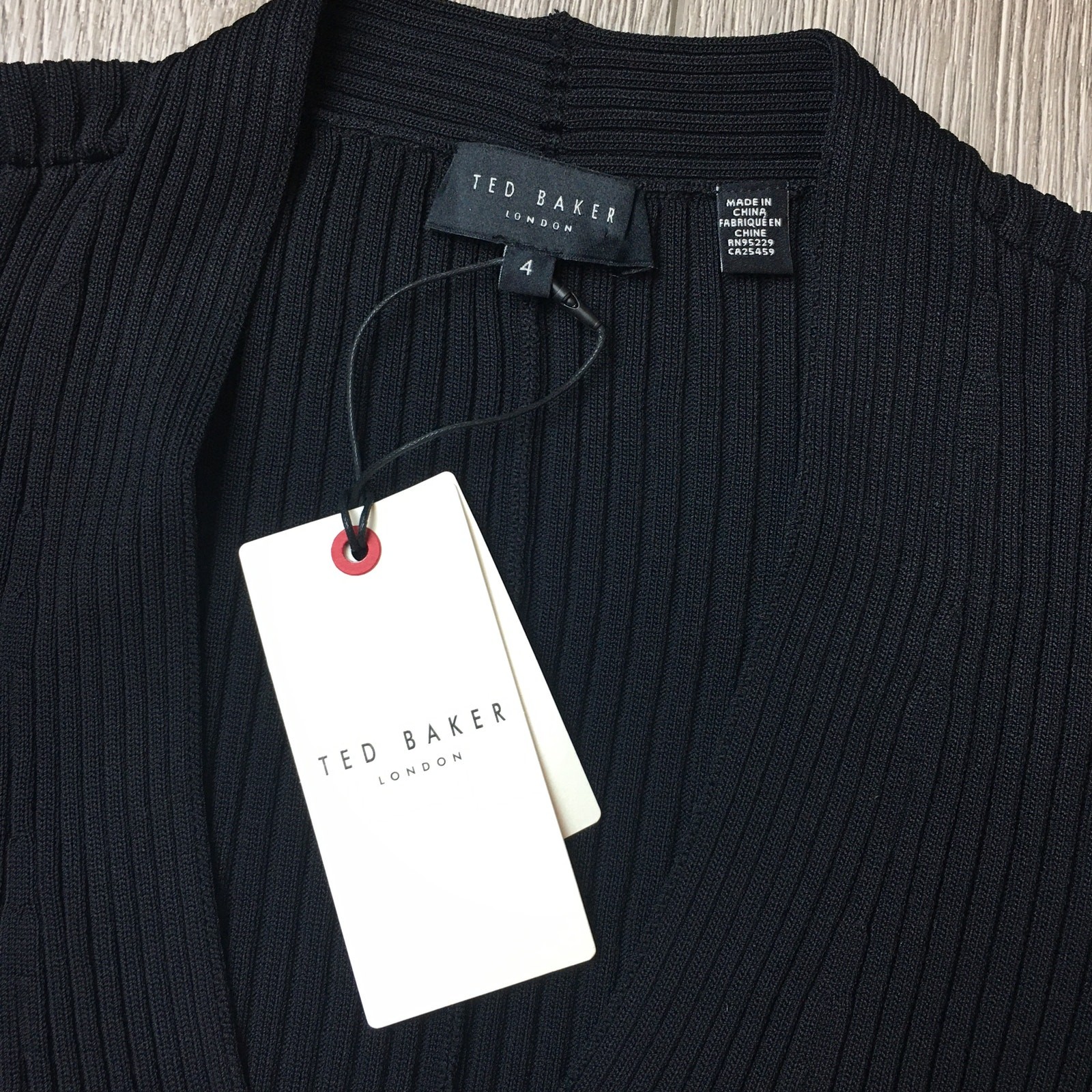 NWT ted baker rib detail knit top with extreme sleeves Size 4 Black