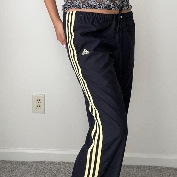 vintage adidas sporty black low waist track pants with yellow stripes