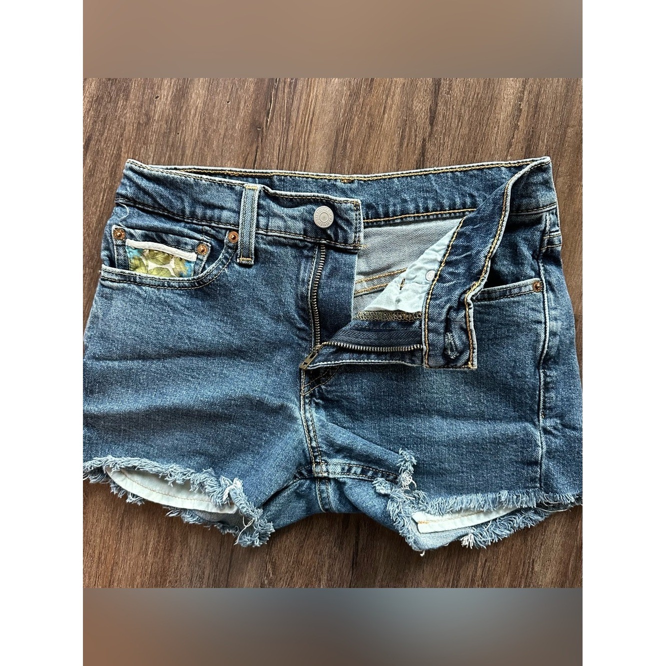 Upcycled Levi’s 511 Cut Off Shorts with Embroidered Pockets. Size 28; Runs Small